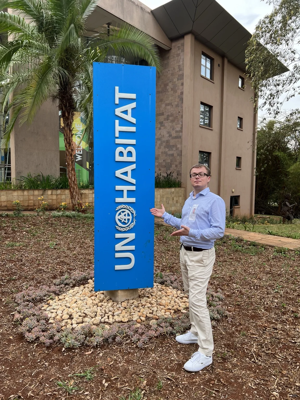 Aleksandr Shestakov by the UN-Habitat sign in Nairobi