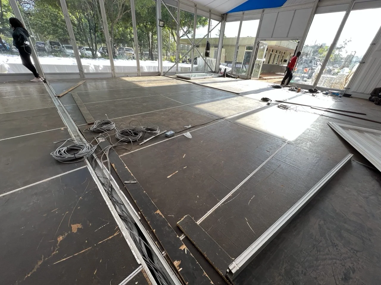 Temporary floor, power and cabling installation inside the registration tent