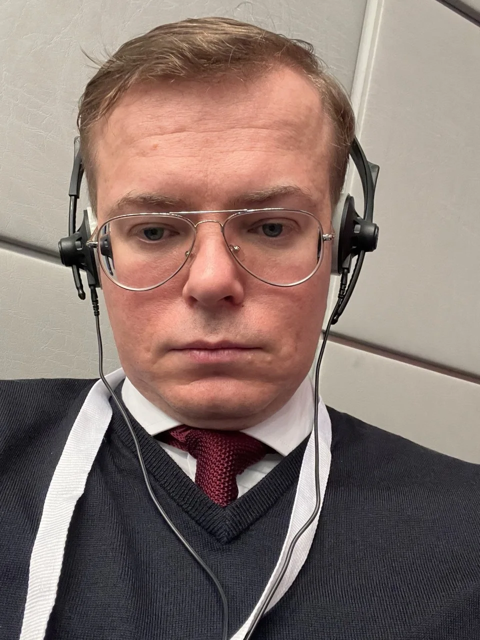 Aleksandr Shestakov using interpretation headphones during an OSCE meeting
